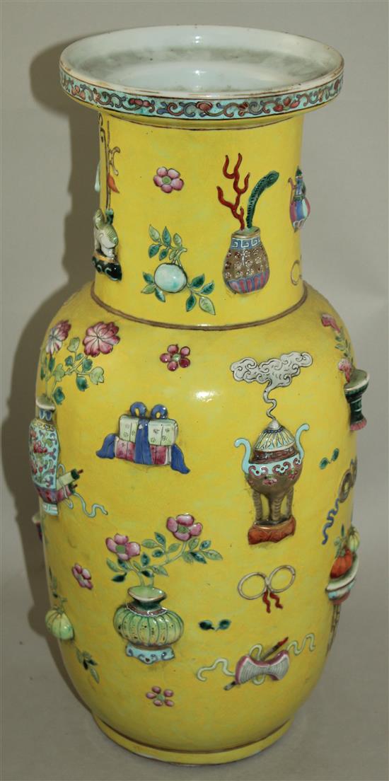 A large Chinese yellow ground and moulded Hundred Antiques vase, 19th century, 44cm